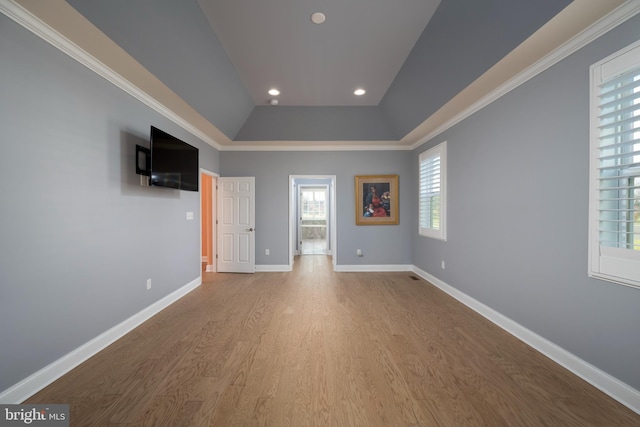 unfurnished bedroom with light hardwood / wood-style floors and ornamental molding