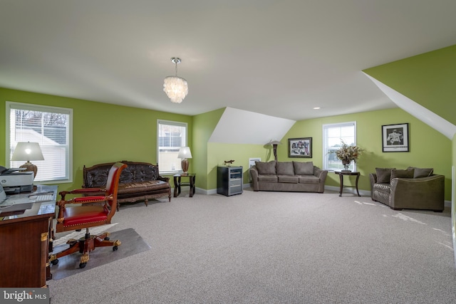 office area featuring carpet and vaulted ceiling