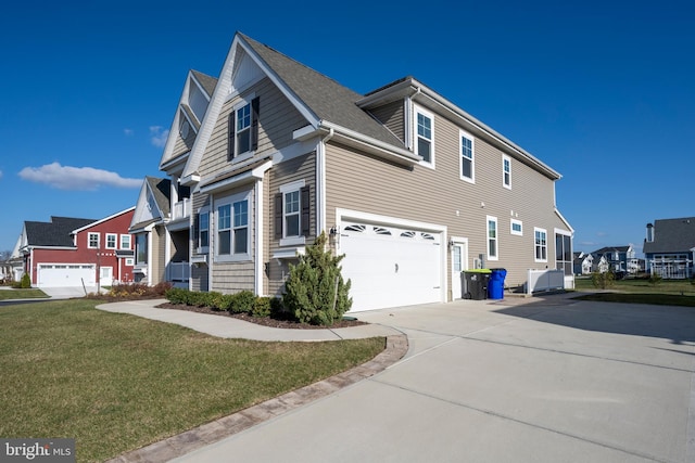 view of home's exterior with a lawn and a garage