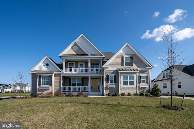 view of front of property with a porch and a front yard