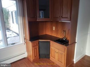 kitchen featuring sink and baseboard heating