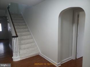 stairs with wood-type flooring