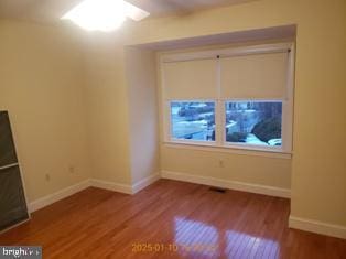 unfurnished room featuring hardwood / wood-style flooring and ceiling fan