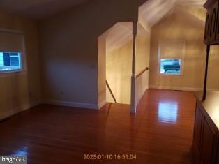 bonus room featuring dark hardwood / wood-style flooring