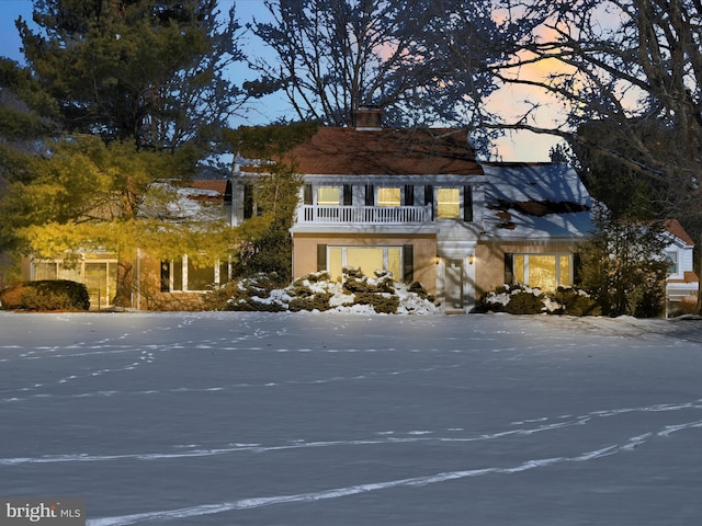 view of front of house featuring a balcony