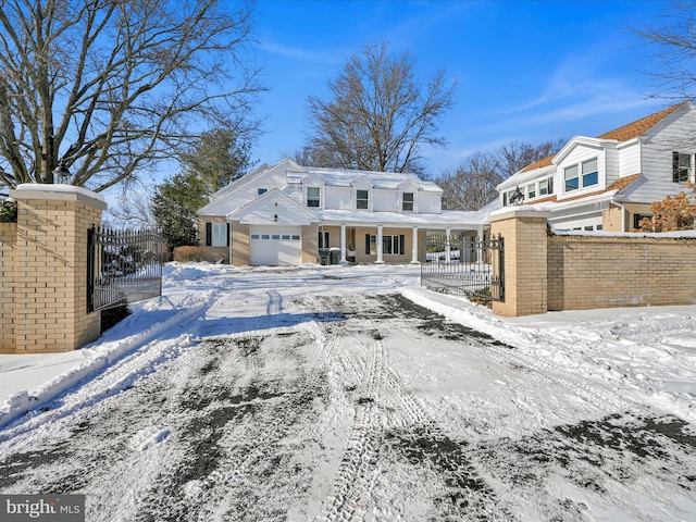 view of snow covered back of property