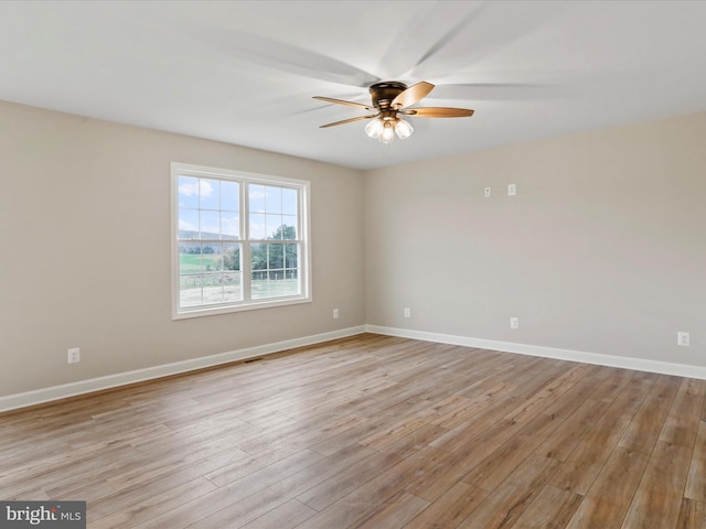 unfurnished room featuring ceiling fan and light wood-type flooring