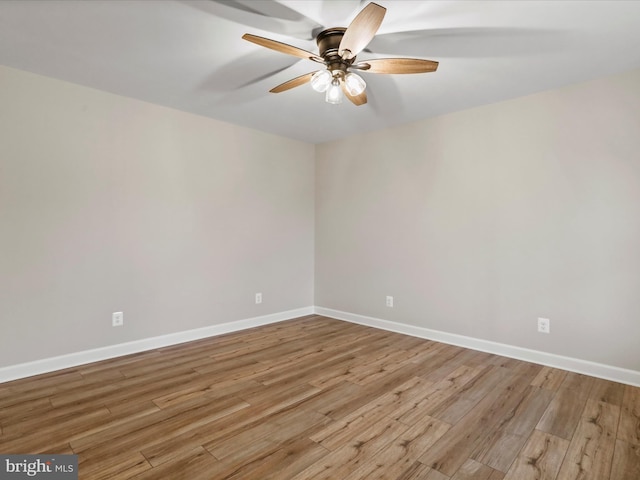 empty room with light wood-type flooring and ceiling fan