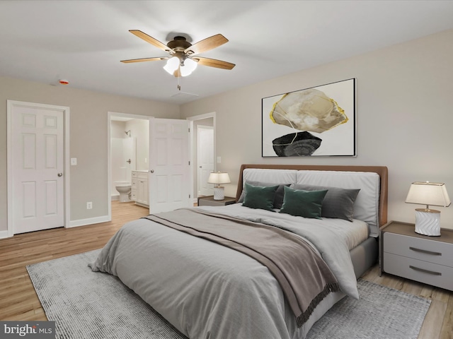 bedroom with connected bathroom, ceiling fan, and light hardwood / wood-style flooring