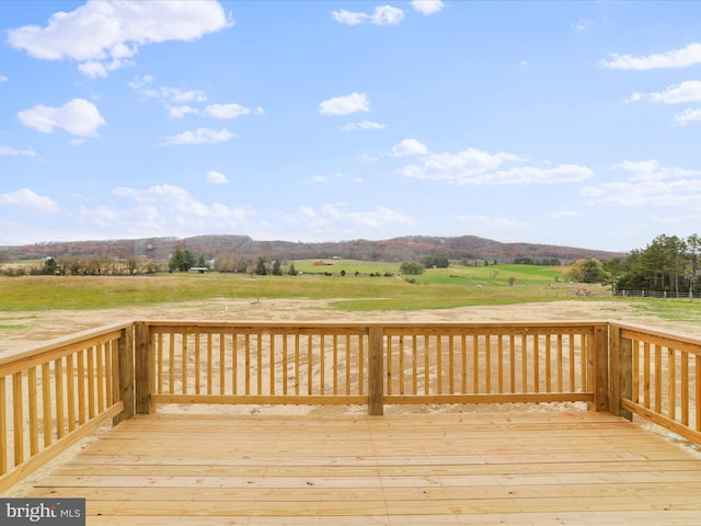 wooden terrace with a mountain view and a rural view