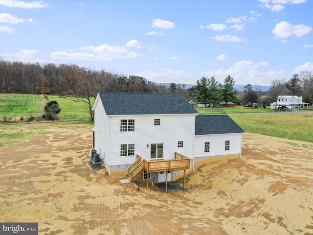 back of house with a wooden deck and central AC