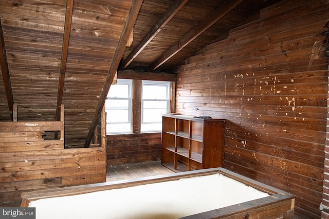 bathroom featuring vaulted ceiling with beams, wooden walls, wood-type flooring, and wooden ceiling