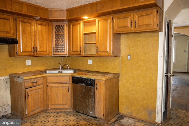 kitchen with ventilation hood, dishwasher, light wood-type flooring, and sink