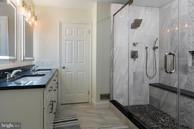 bathroom with vanity and an enclosed shower