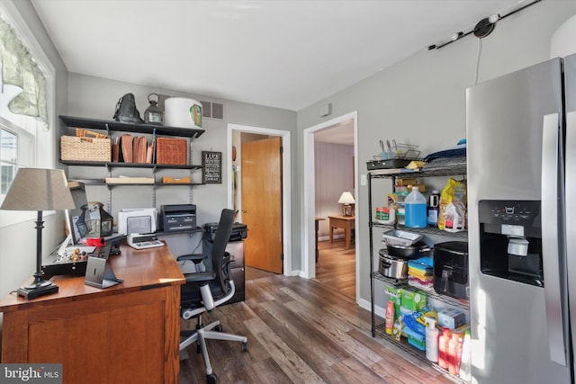 home office with hardwood / wood-style flooring