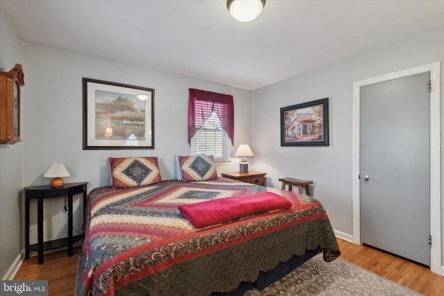 bedroom featuring hardwood / wood-style flooring