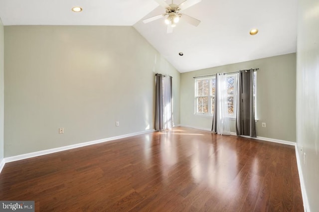 spare room featuring hardwood / wood-style flooring, ceiling fan, and lofted ceiling