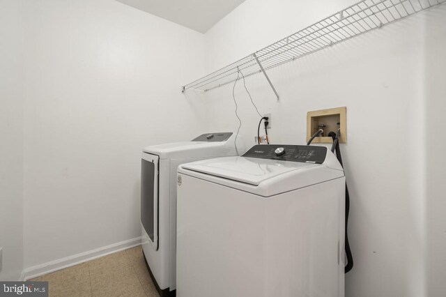 clothes washing area featuring washing machine and dryer