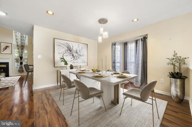 dining area with dark hardwood / wood-style flooring