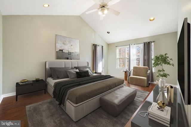 bedroom with dark hardwood / wood-style floors, vaulted ceiling, and ceiling fan