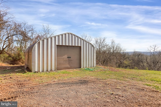 view of outbuilding featuring a garage