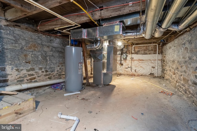 basement featuring heating unit and water heater