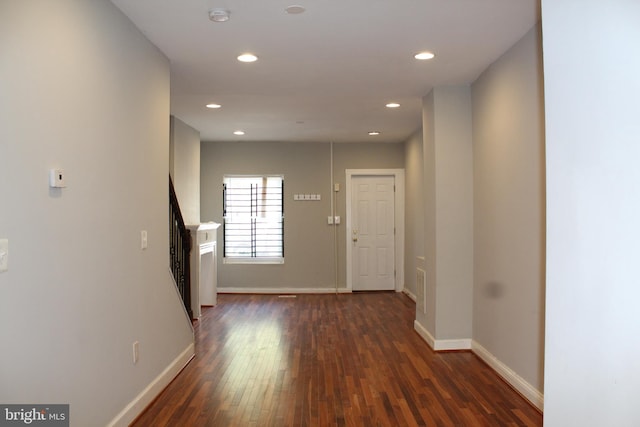 hallway featuring dark wood-type flooring