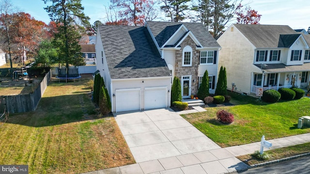 view of front of house featuring a front lawn and a trampoline