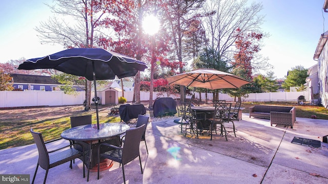 view of patio / terrace featuring a storage shed