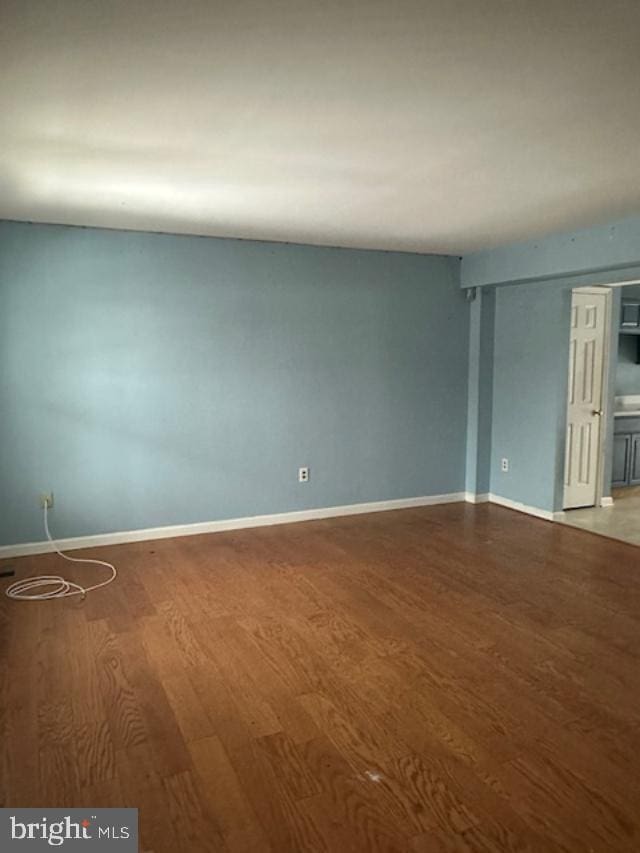 spare room featuring hardwood / wood-style floors