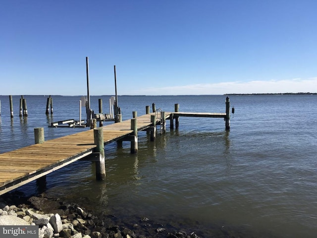 dock area featuring a water view and boat lift