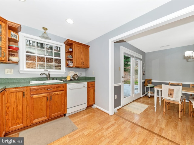 kitchen with dishwasher, light wood-type flooring, and sink