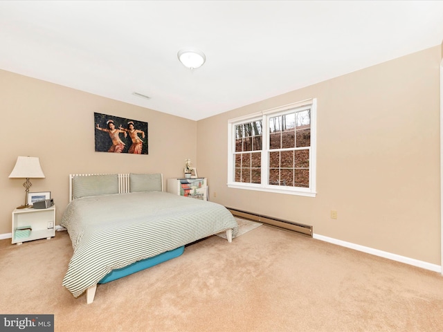 carpeted bedroom with a baseboard radiator