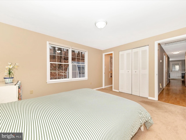 carpeted bedroom featuring a closet