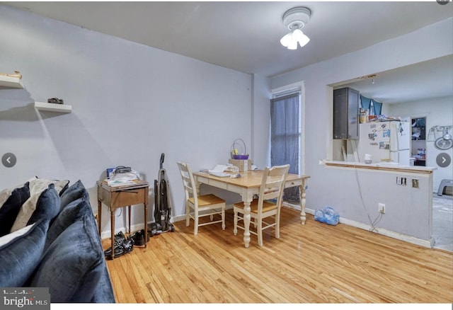 dining room featuring light wood-type flooring