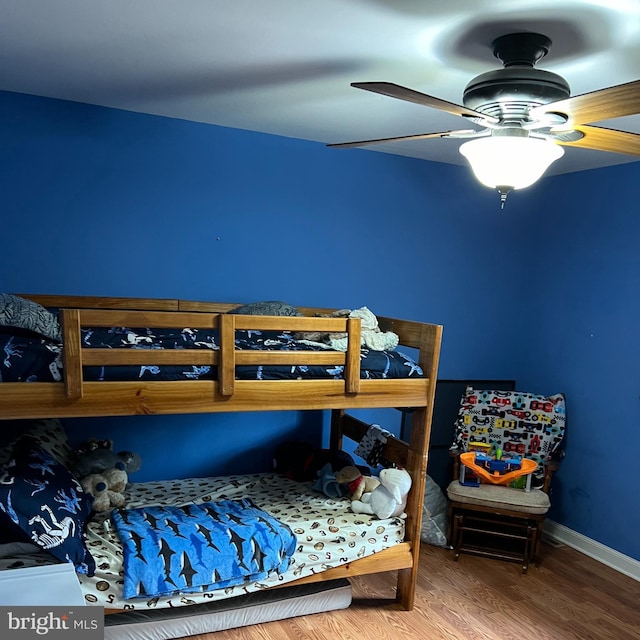 bedroom with ceiling fan and hardwood / wood-style floors