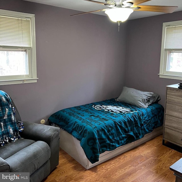 bedroom featuring ceiling fan and hardwood / wood-style flooring