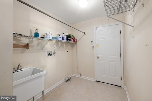 laundry room with electric dryer hookup, light carpet, sink, and washer hookup