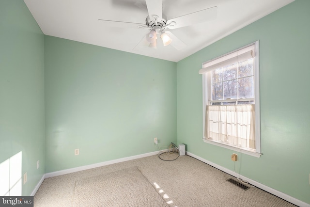 spare room with carpet and ceiling fan