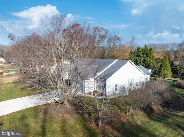 view of property exterior featuring a yard