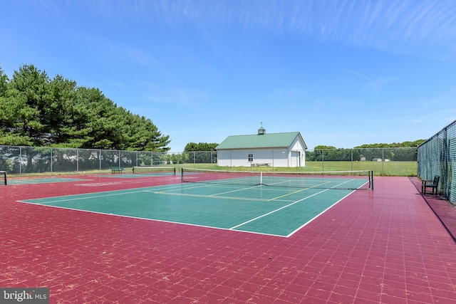 view of sport court with basketball hoop