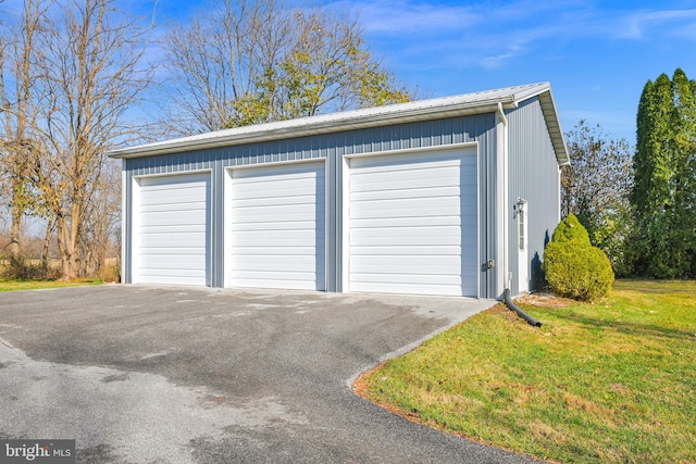 garage with a yard