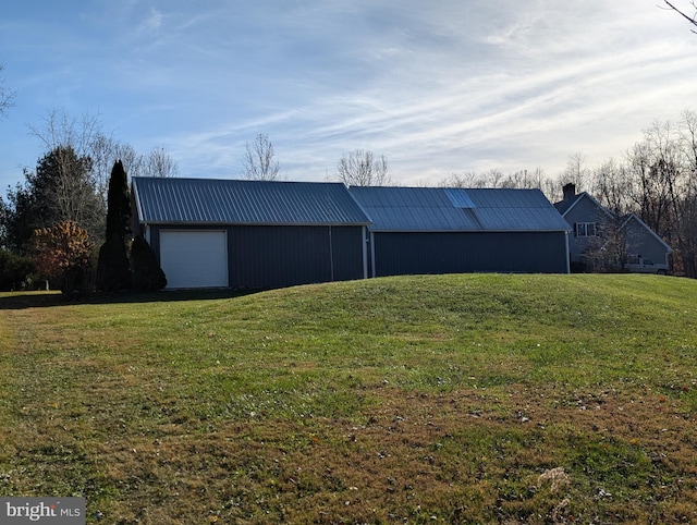 garage with a lawn