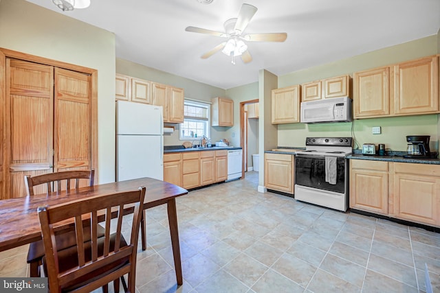 kitchen featuring light brown cabinetry, ceiling fan, sink, and white appliances