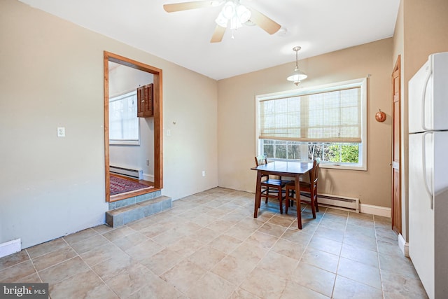 dining room with ceiling fan, light tile patterned floors, and a baseboard radiator