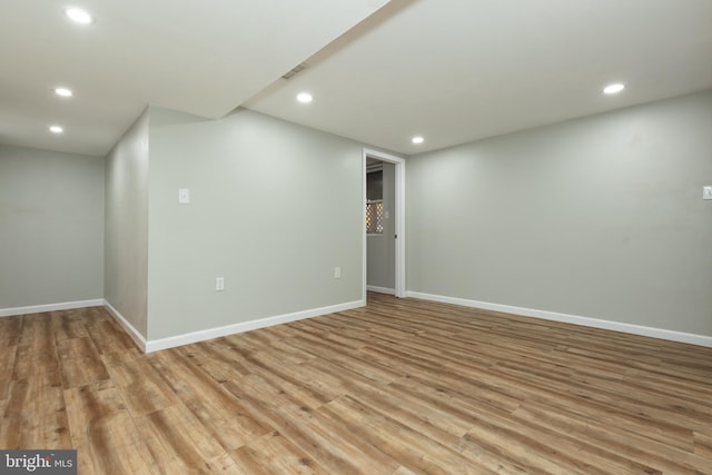 basement featuring light wood-type flooring