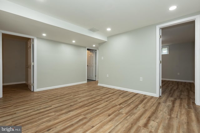 spare room with light hardwood / wood-style floors