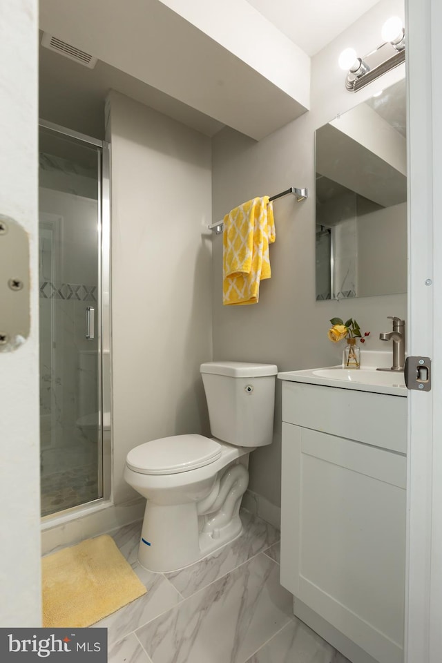 bathroom with walk in shower, vanity, and toilet