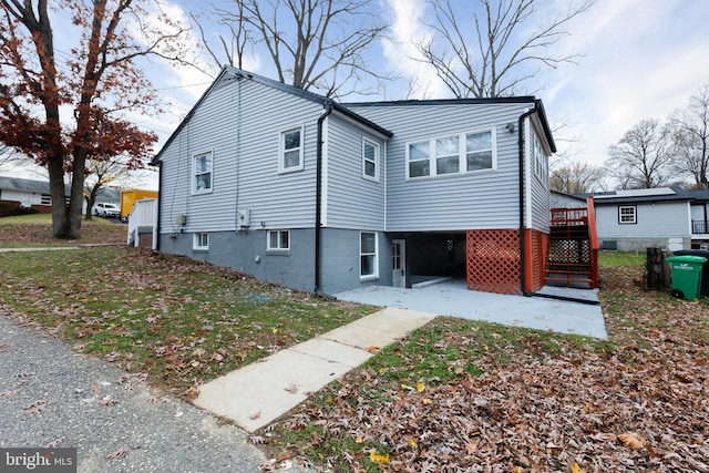 exterior space featuring a patio area and a front yard