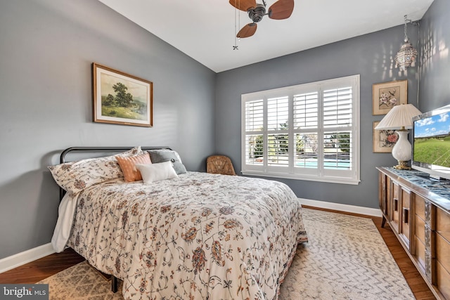 bedroom featuring ceiling fan and dark wood-type flooring